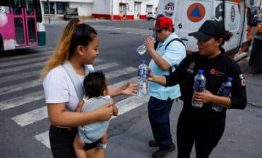 Civil Protection Services Handing Citizens Water Bottles During Extreme Heatwave In Mexico