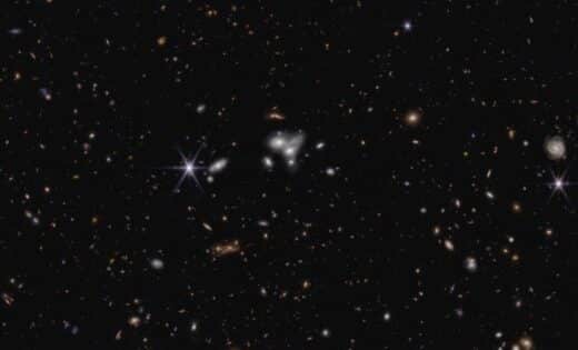 Webb Telescope Discovers Record Breaking Black Hole Merger In Ancient Universe